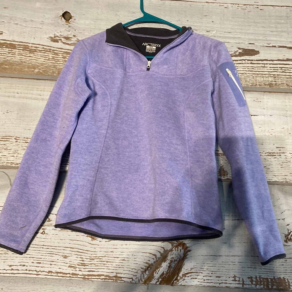 purple arc teryx crewneck with a zipper
